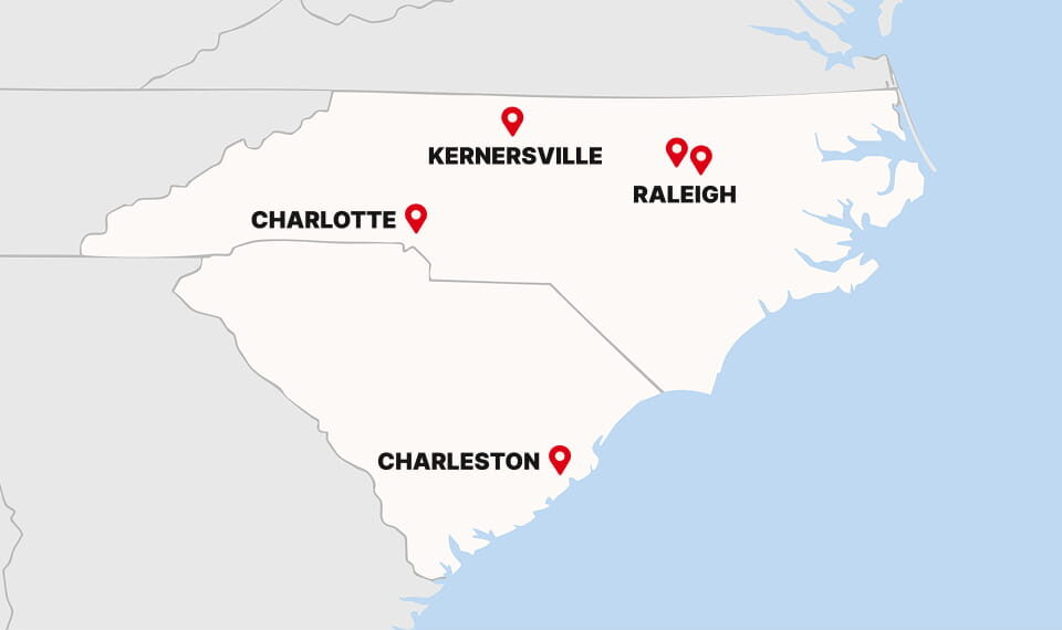 Map showing locations of Charlotte, Kernersville, and Raleigh in North Carolina, and Charleston in South Carolina, marked with red pins.